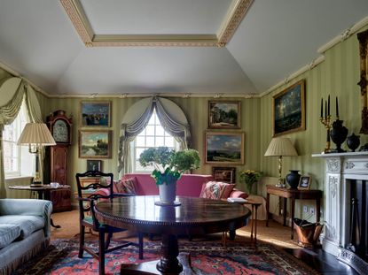 Fig 2: The drawing room, with its reconstructed Regency fireplace and coved plaster ceiling, created out of the former schoolroom. Church Cottage, Humbleton, South Yorkshire. Photographed by Paul Highnam for Country Life. &copy;Country Life