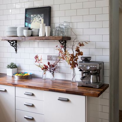 Kitchen area with a coffee machine on it