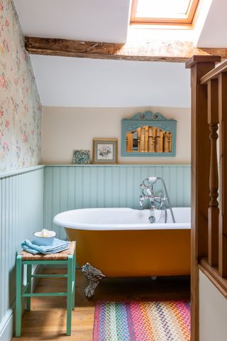 cottage bathroom ideas orange bath in a blue panelled cottage bathroom