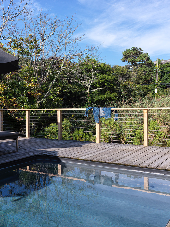 Fire Island tour of house in the pines, timber structure and pool ad warm interiors