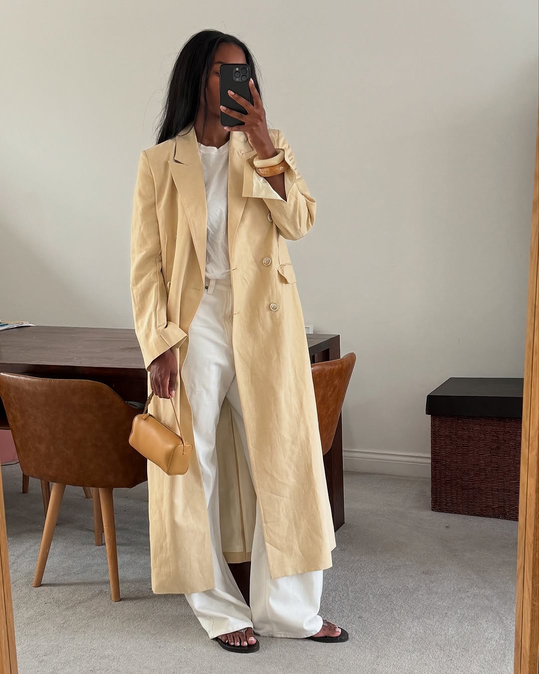 Woman wearing camel colored clothing summer 2025