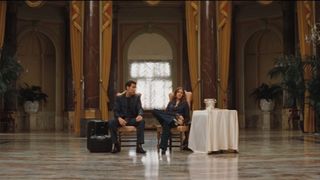 Julia Roberts and Clive Owen sit in a fancy lobby at the end of Duplicity