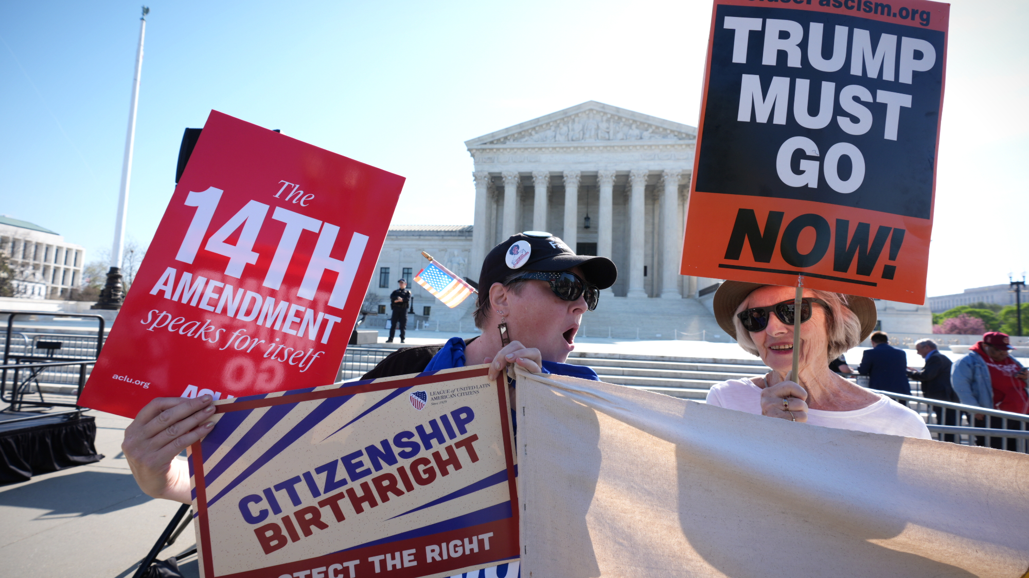 Protesters outside Supreme Court where President Donald Trump attended arguments