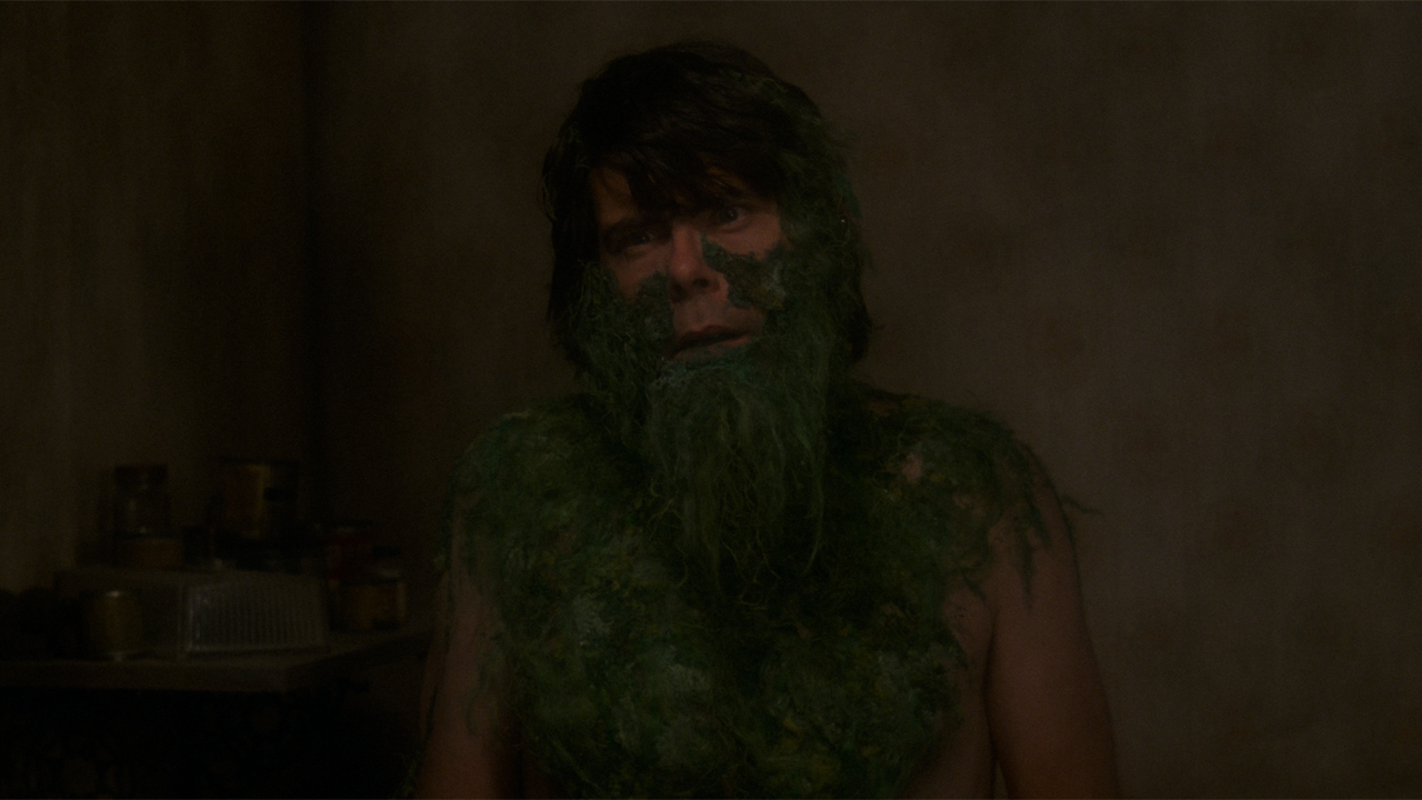 Stephen King covered in grass in Creepshow