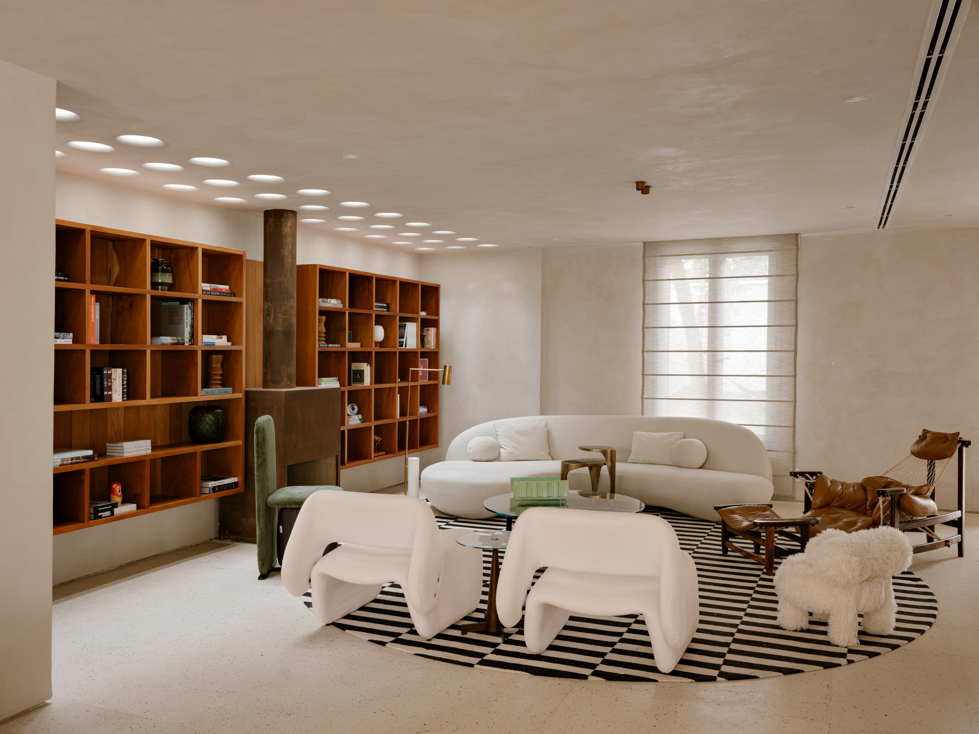 The main living room, arranged around a central fireplace