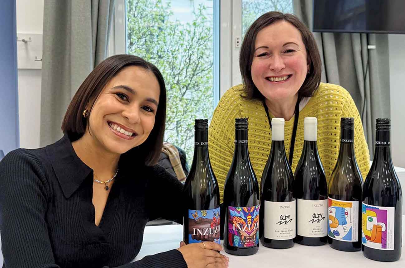 Kaylin Willscott and Julie Sheppard with bottles of wine