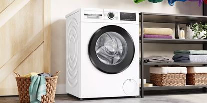 A white washing machine shown in a laundry room