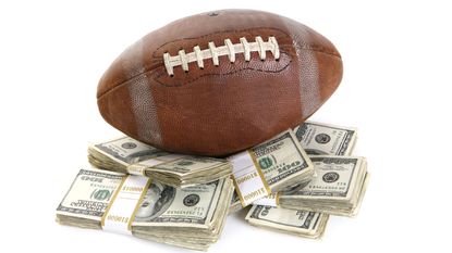 football on stacks of money