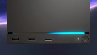 Close up of Steam Machine with blue LED strip on front and SteamOS backdrop.