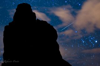 A Quadrantid meteor shower streaks across the night sky over Tenerife in Spain's Canary Islands in this 2012 photo captured by photographer Roberto Porto. The 2015 Quadrantid meteor shower will peak on Saturday, Jan. 3.