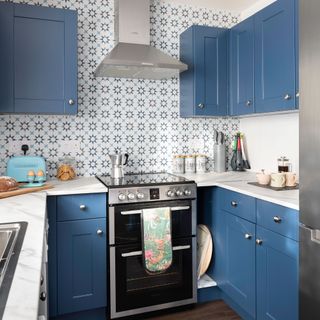Blue kitchen with white and blue tiles