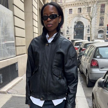 Sylvie Mus in Paris wearing a leather jacket and denim pencil skirt.