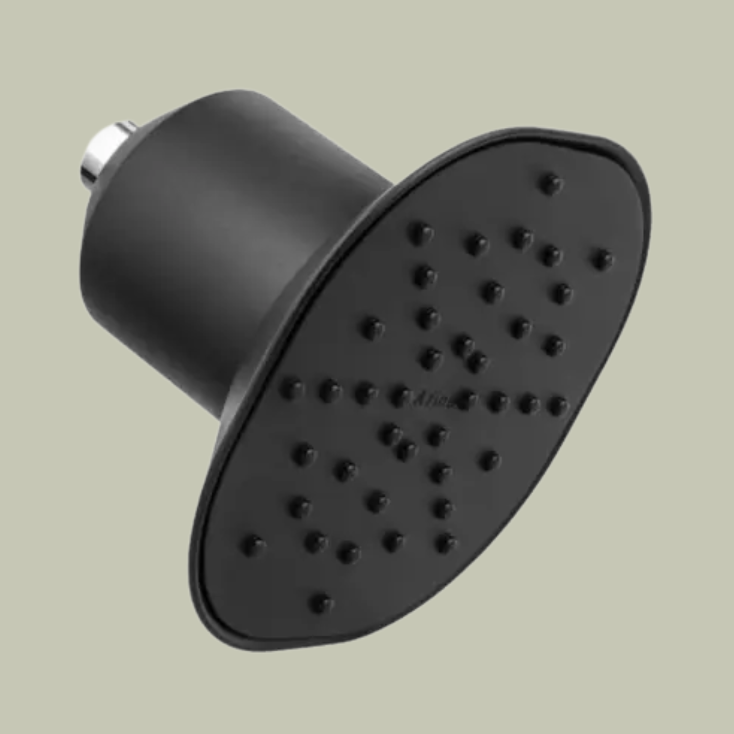 A matte black filtering shower head against a light green backdrop