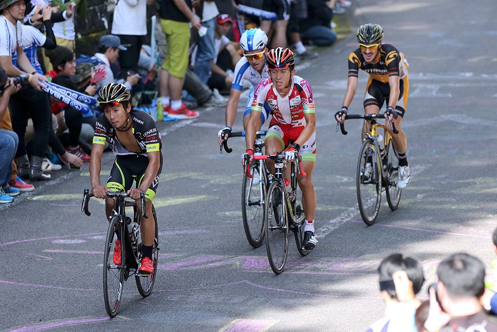The breakaway riders struggle on