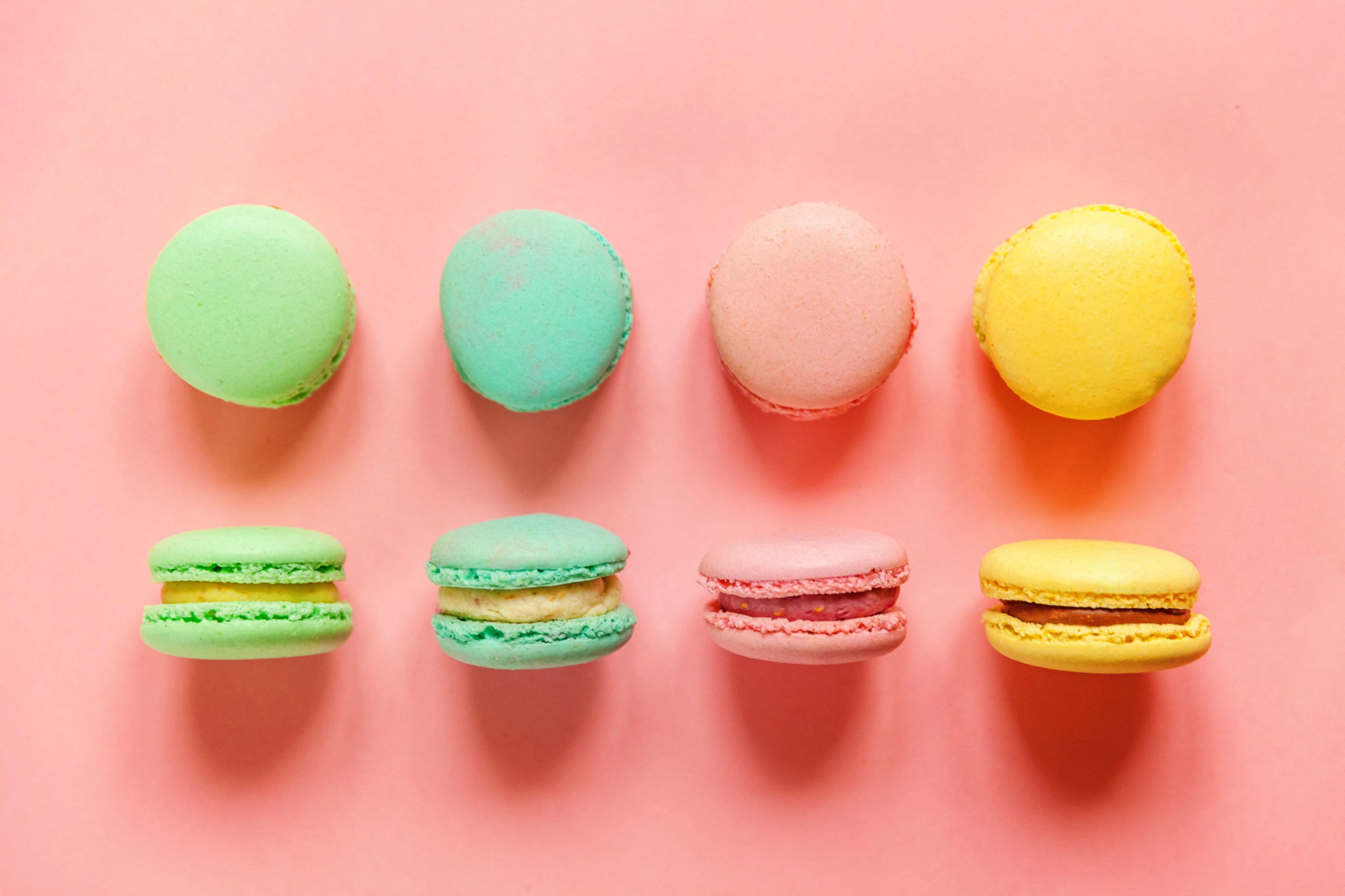 Colourful Macarons on a soft pink background