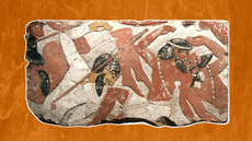 painted relief fragment with conquered enemies on an orange background