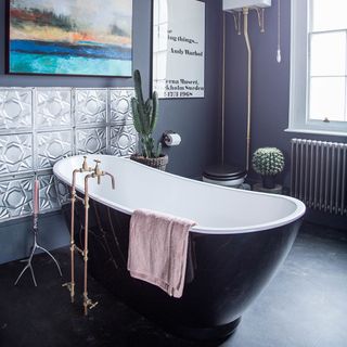 bathroom with black floor tiles