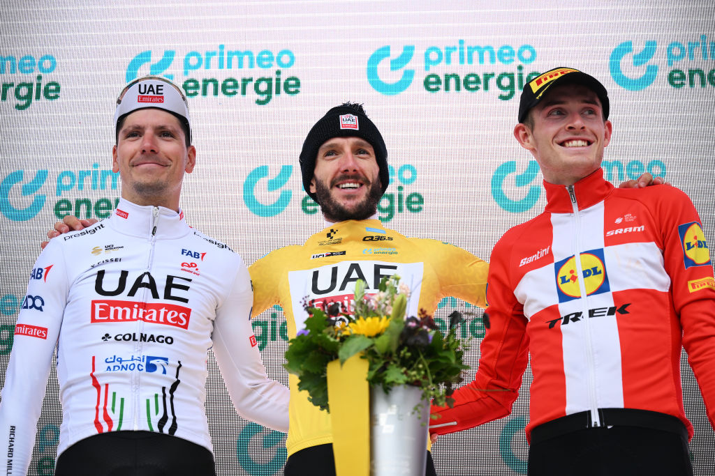 VILLARSSUROLLON SWITZERLAND JUNE 16 LR Joao Almeida of Portugal and UAE Team Emirates on second place race winner Adam Yates of The United Kingdom and UAE Team Emirates Yellow leader jersey and Mattias Skjelmose of Denmark and Team Lidl Trek on third place pose on the podium ceremony after the 87th Tour de Suisse 2024 Stage 8 a 157km individual time trial stage from Aigle to VillarssurOllon 1249m UCIWT on June 16 2024 in VillarssurOllon Switzerland Photo by Tim de WaeleGetty Images