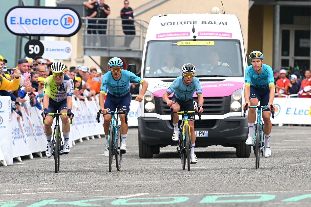 Mark Cavendish crosses the finish line of stage 14 of the 2024 Tour de France, just within the time limit