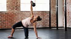 Woman trains with a kettlebell