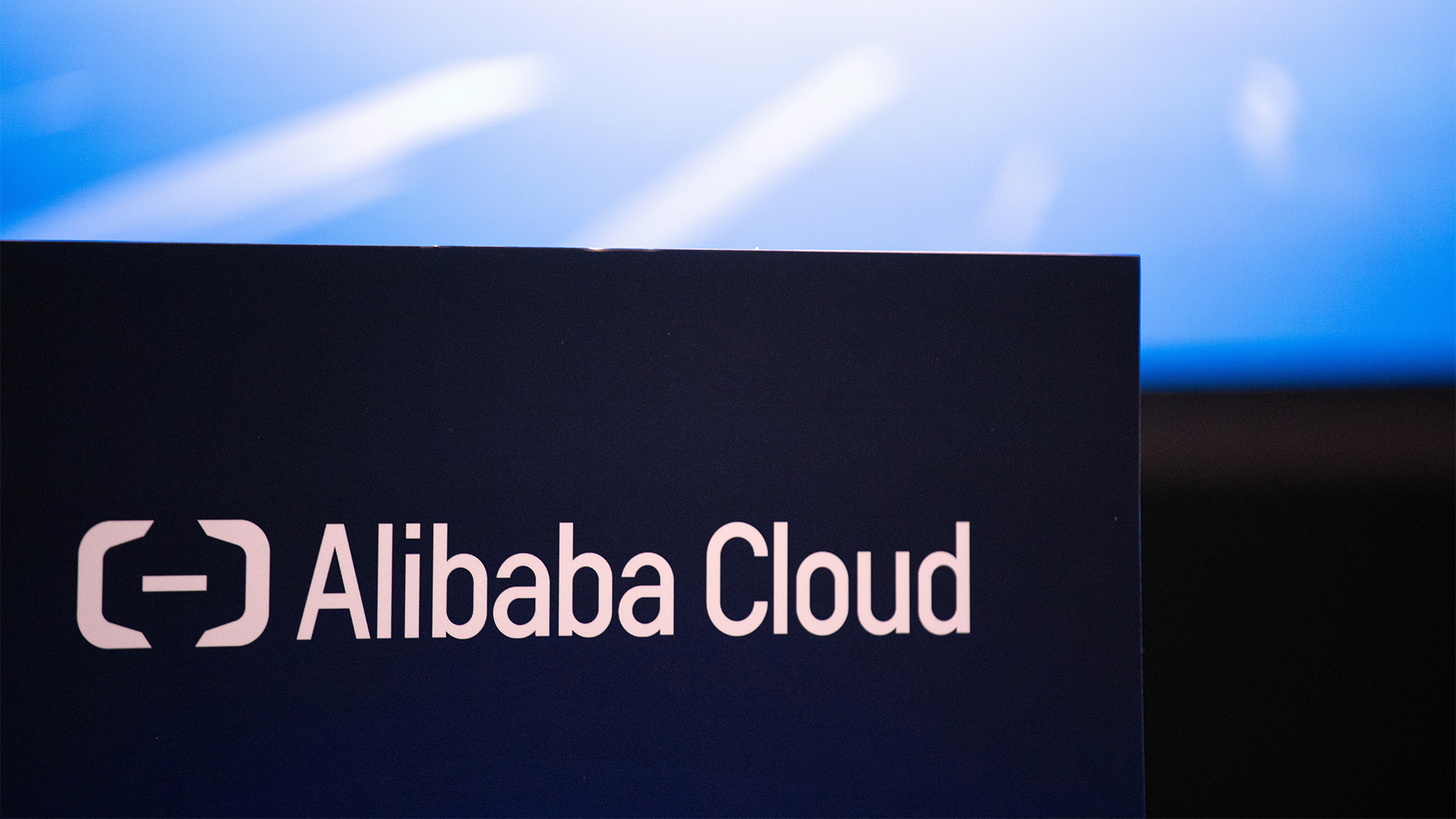 Alibaba Cloud logo and branding displayed on a banner during the Alibaba Cloud AI Tech Day event in Kuala Lumpur, Malaysia.