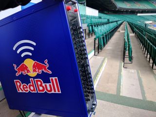 Riedel wireless communications system with Red Bull blue, red, and gold logo on it.