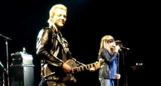 Billy Zoom (left) and Exene Cervenka of X perform onstage – Zoom has his customary Gretsch guitar, his hair dyed blond