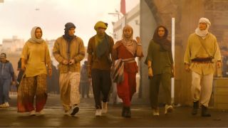 The Pogues (l-r): Sarah, John B, Pope, Cleo, Kiara, and JJ in stolen Moroccan clothes walking to the port