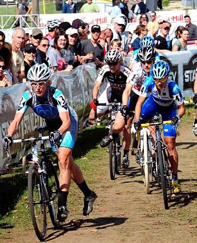 Sue Butler (MonaVie-Cannondale) gets to the barriers first on lap one.