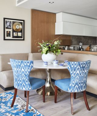 Dining room with corner table and colorful chairs