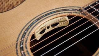 Best acoustic guitars: Close up of an LR Baggs pickup system in the soundhole of an Eastman acoustic guitar