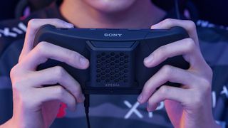 A mobile gamer using the new Xperia Stream by Sony for mobile gaming.