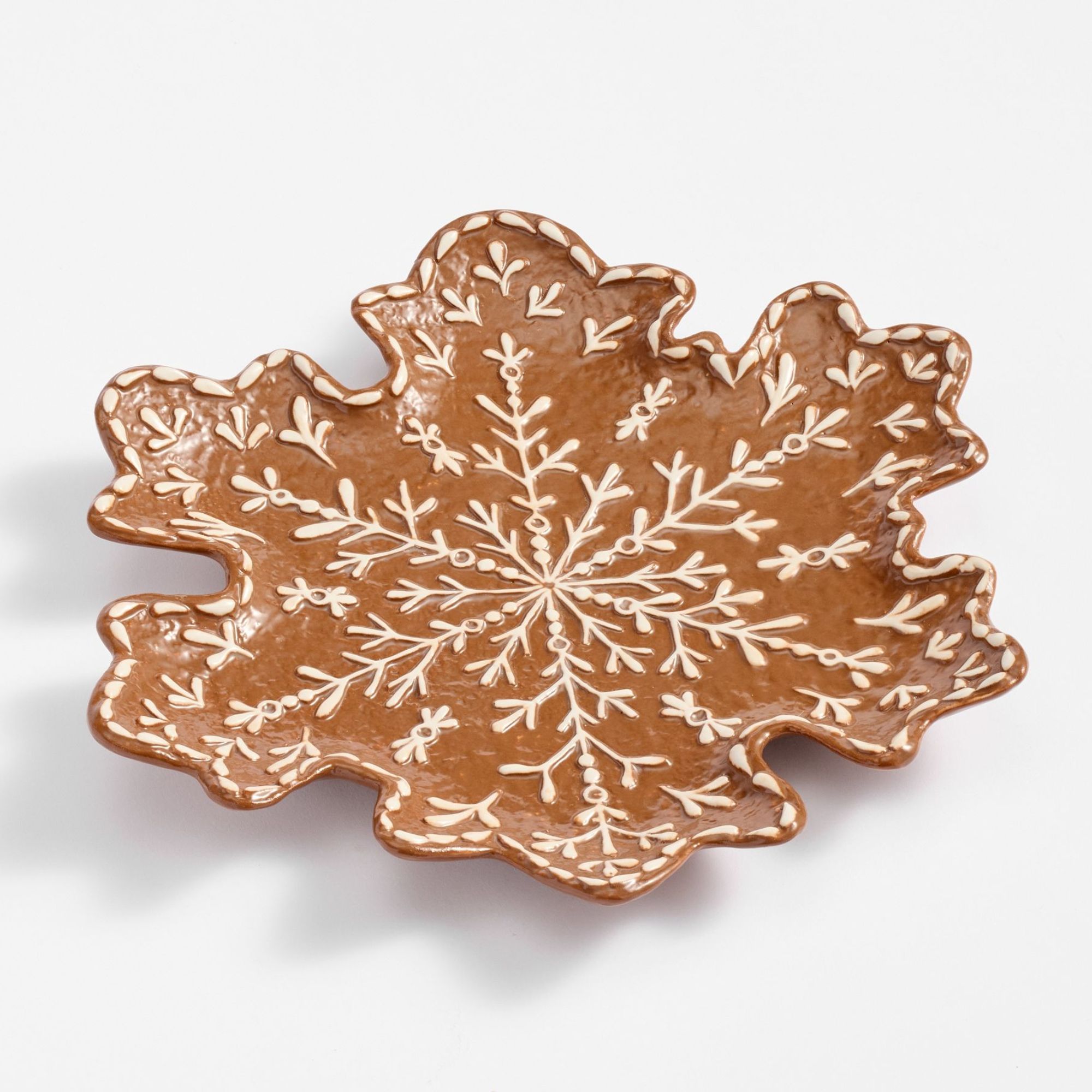 Snowflake-shaped platter with gingerbread design
