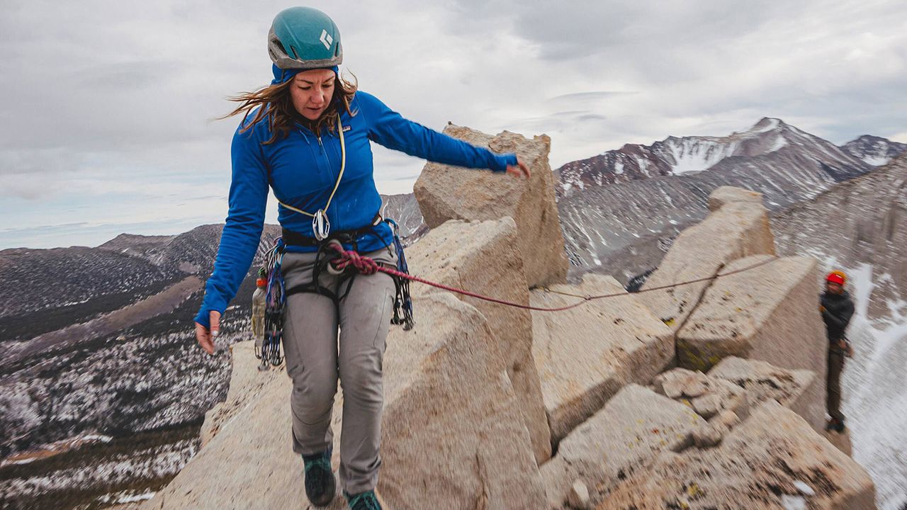 Person climing mountains in Patagonia gear