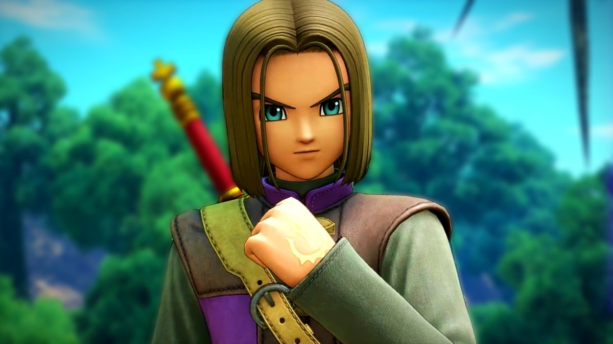 Dragon Quest XI screenshot showing the protagonist - a male character with shoulder-length brown hair and bright light blue eyes with a determined expression