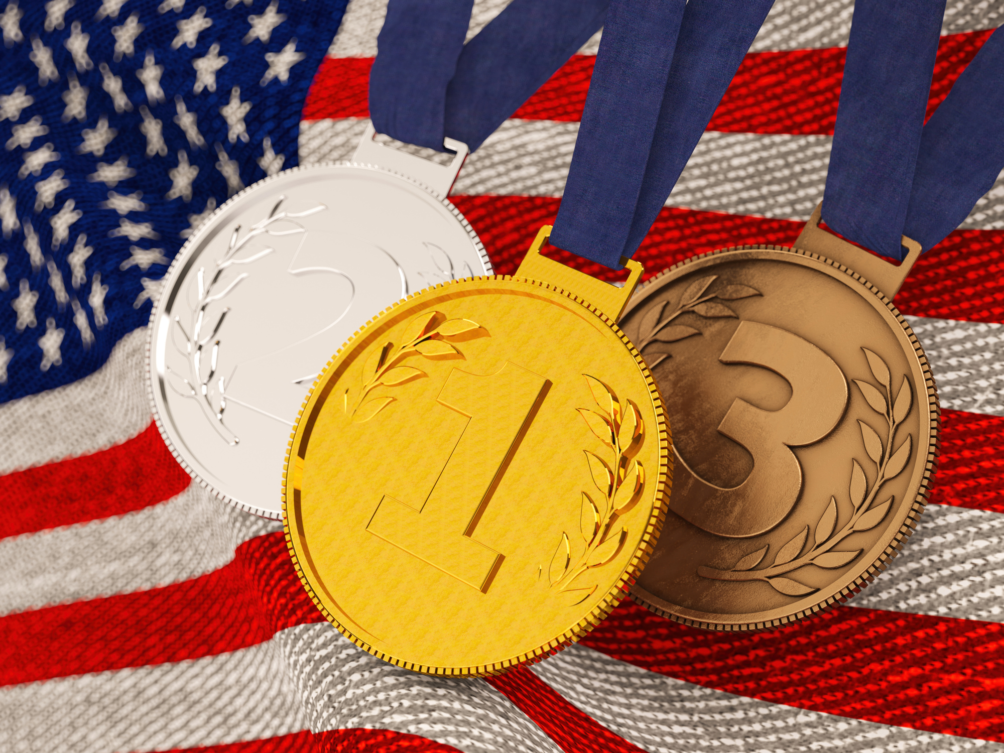 Gold Silver and Bronze Sports Medals on American Flag. 3D Render