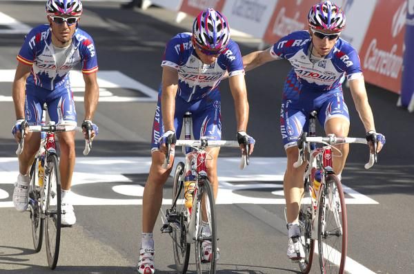 Serguei Ivanov (center) helped to the line by his Katusha teammates.