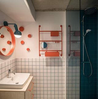 red & white tiled bathrooms inside BaseCamp’s Leipzig location