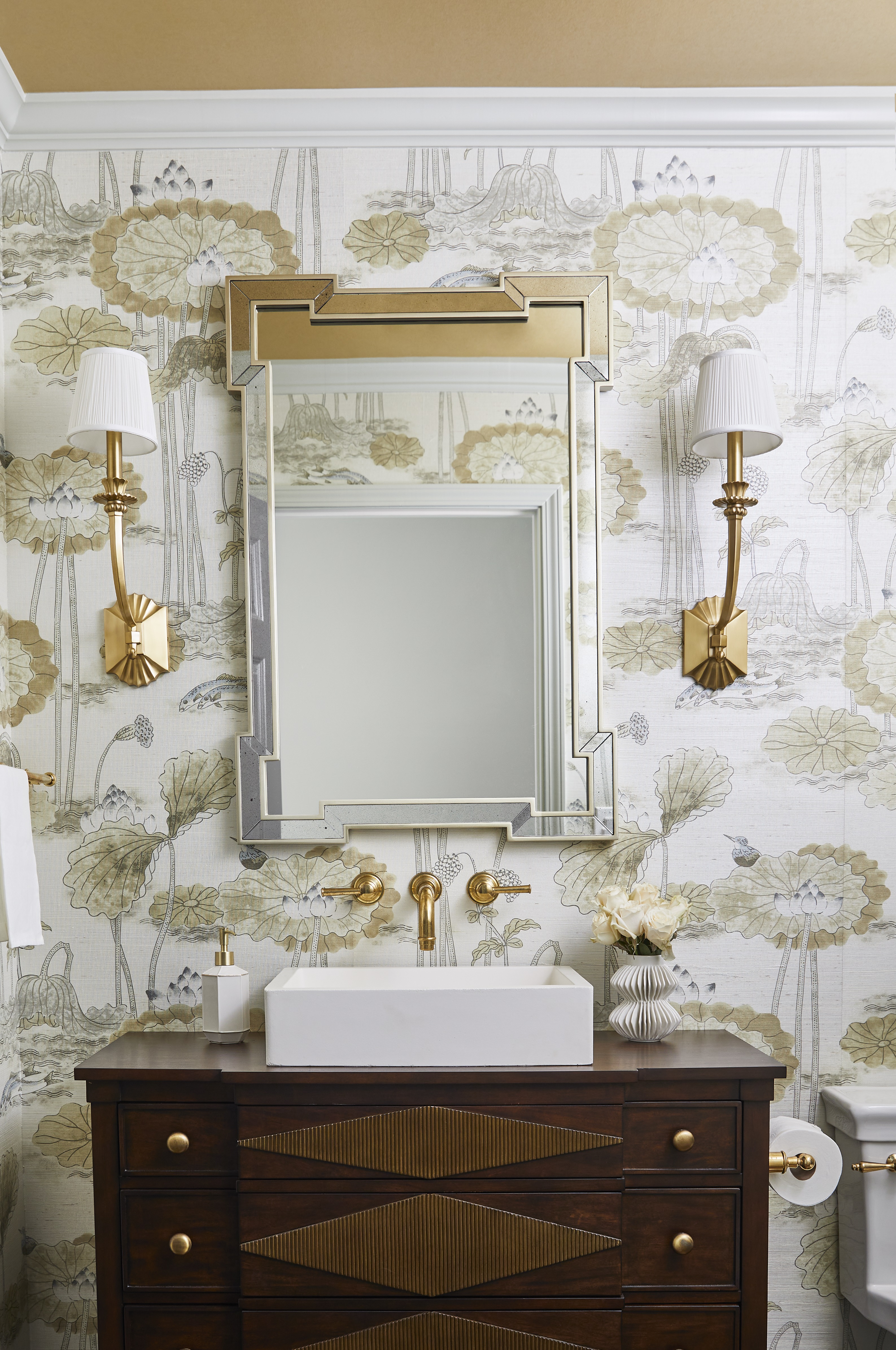 powder room with art deco style wallpaper, mirror and wall lights, vintage vanity