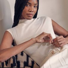 Woman wearing cream Karen Millen dress