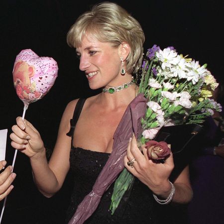 Blonde Princess Diana wears a black Jacques Azagury dress and emerald jewels and receives bunches of flowers and a heart balloon on her 36th Birthday on July 1, 1997 at the Tate in London