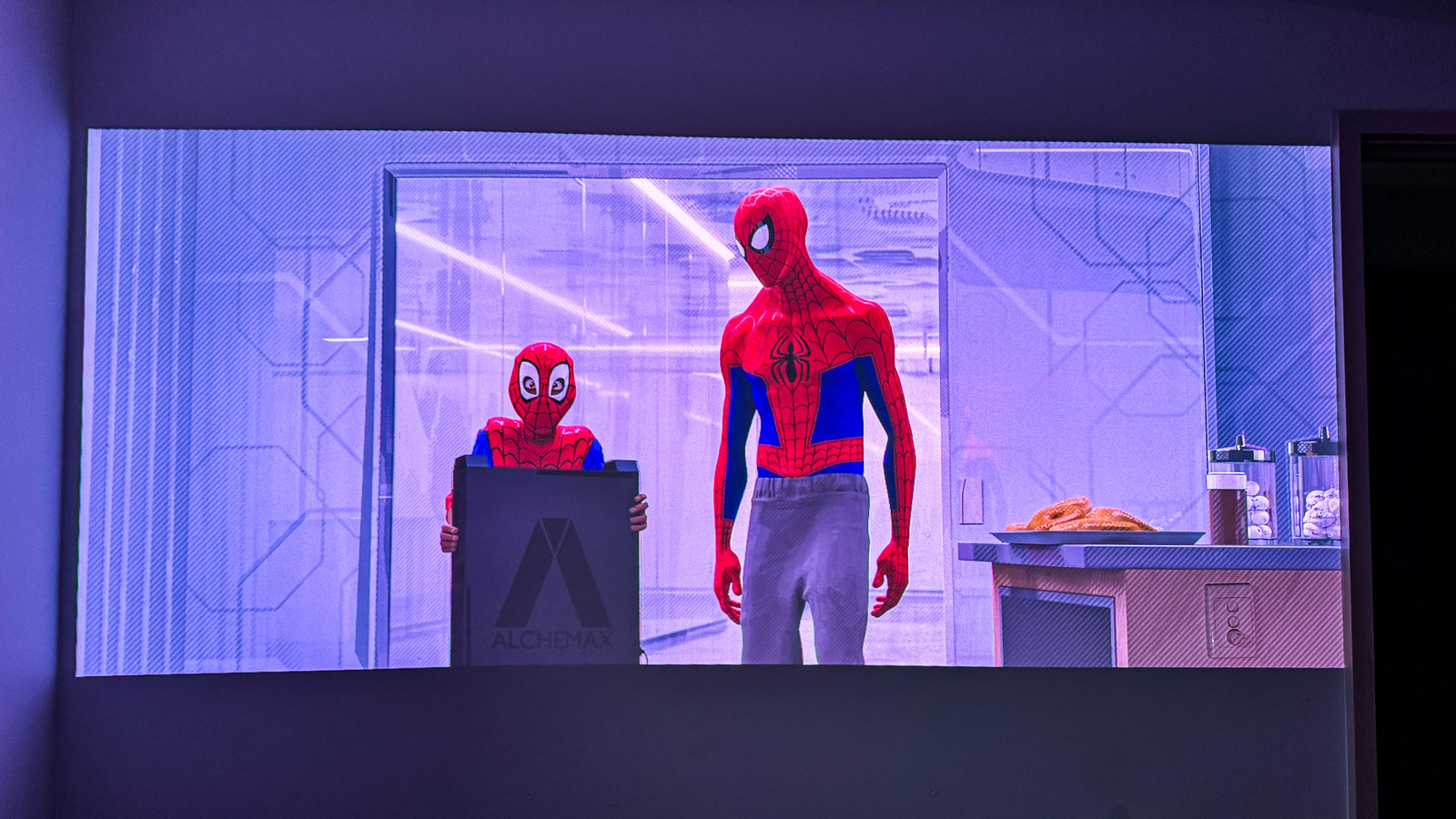 A scene from Spider-Man Across the Spiderverse projected onto a wall.