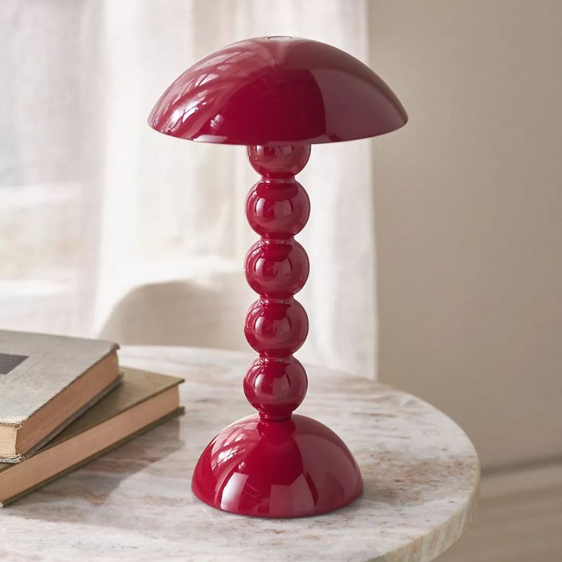 dark red table lamp with bobbin design and gloss finish