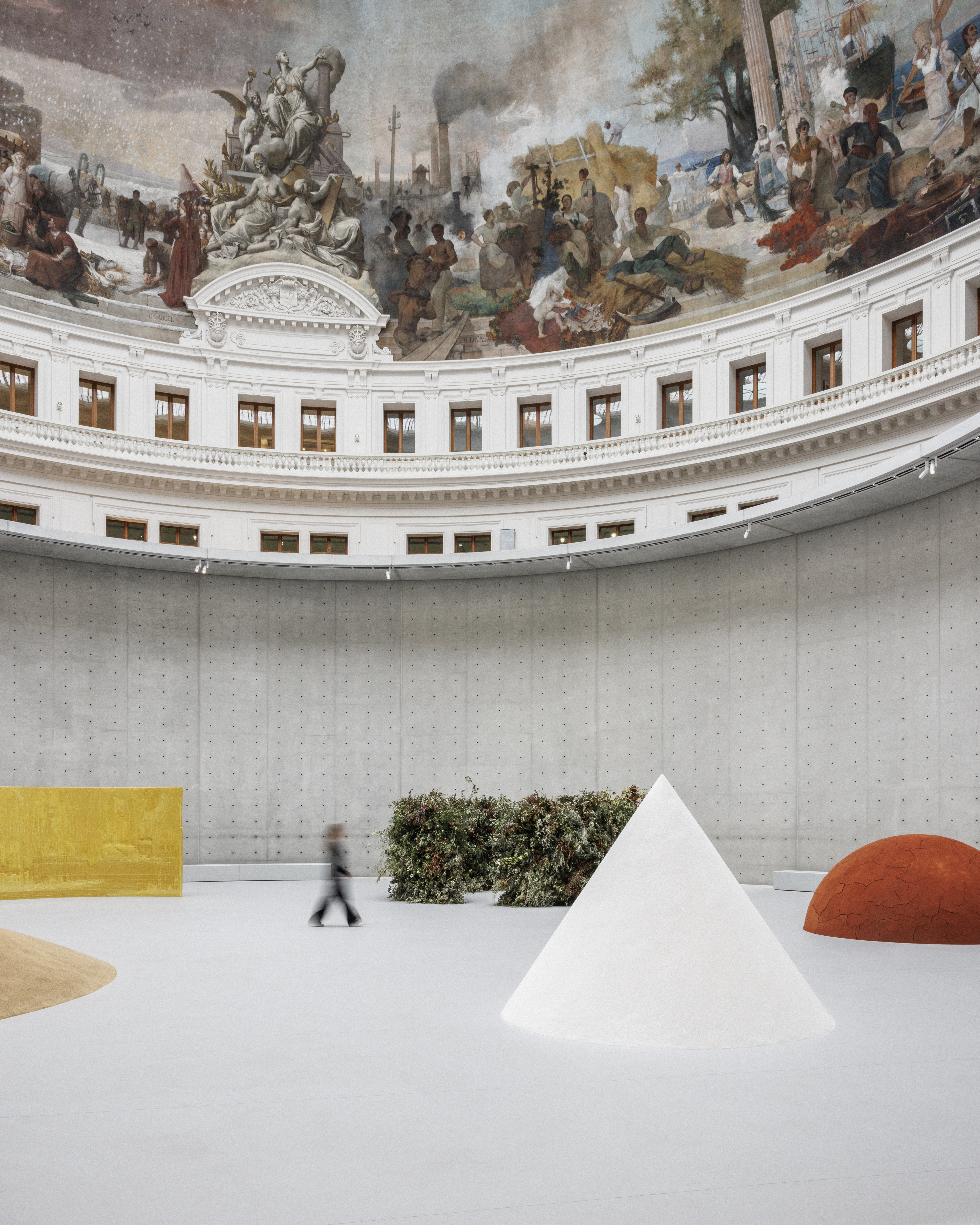A spectacular, frescoed chapel with narrative friezes houses a minimal design exhibition of geometric forms in velvety textures.