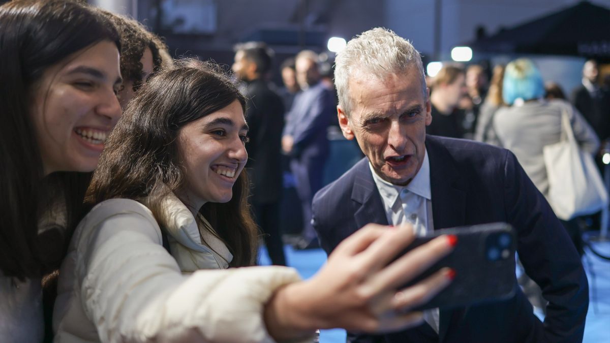Fans take a photo with Peter Capaldi at the global premiere of The Devil's Hour.