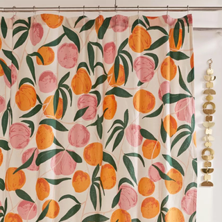 An orange and peach fruit patterned shower curtain