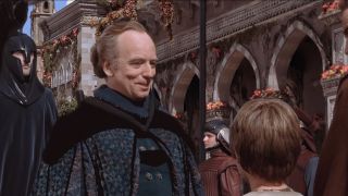 Ian McDiarmid greets Jake Lloyd and Ewan McGregor with enthusiasm in Star Wars: The Phantom Menace.