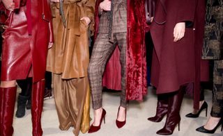 Models wear red leather, burgundy set and brown suede coat with matching handbags, pointed shoes and short hair fur boots
