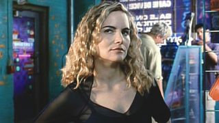 A screenshot shows actress Jennifer Jason Leigh in the movie eXistenZ