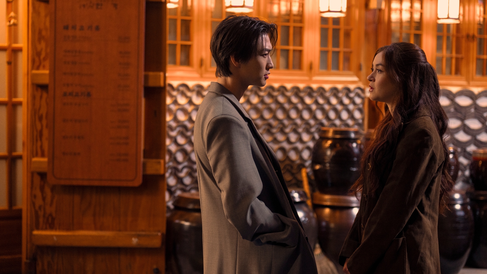 Kitty and Min Ho look at each other in XO, Kitty